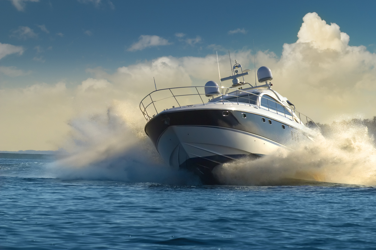 A luxury yacht in fast motion on the water 