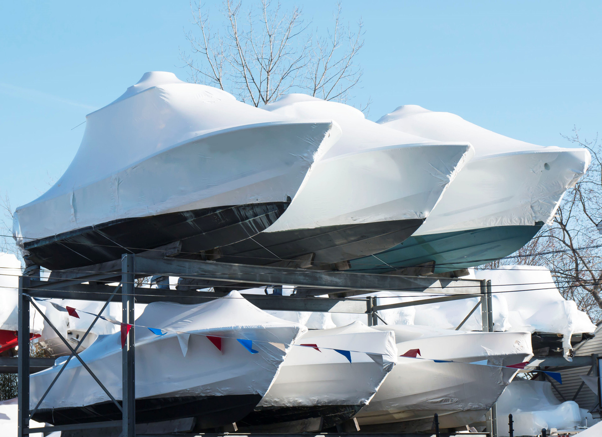 Boats stacked and stored on racks in the winter