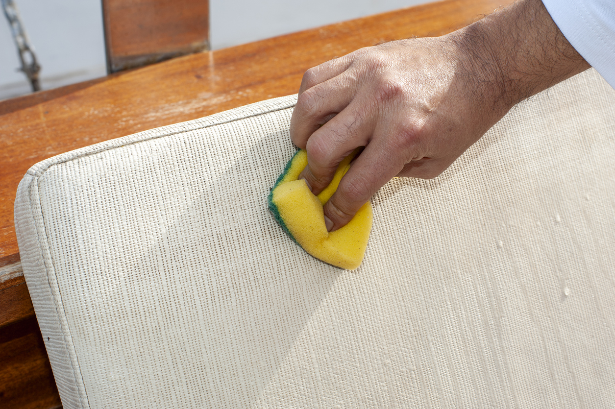 cleaning a beige textile sofa