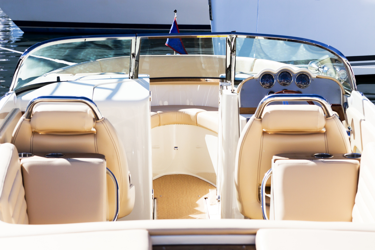 Elevated view Inside of luxury speedboat with leather seats in sunshine, full frame horizontal composition